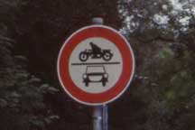 Sign: Speeding motorcycle over car